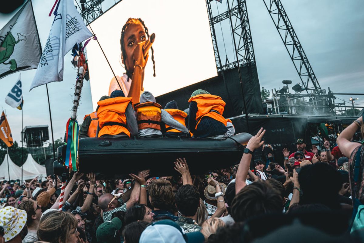 Banksy's inflatable migrant boat artwork is carried across the crowds during Lil Simz's set at Glastonbury 2024 Photo: Luke Brennan/ Getty Images