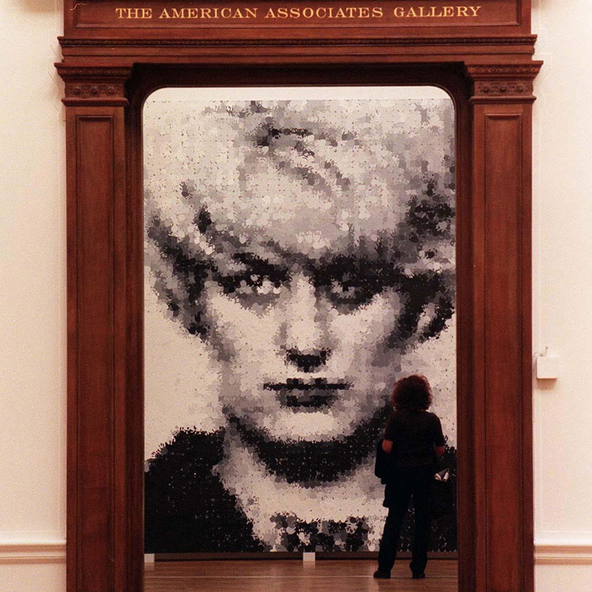 Marcus Harvey, Myra, on show at Sensation, Royal Academy of Arts, London, 1997 © Marcus Harvey. All Rights Reserved, DACS 2022. Installation photograph: PA Images / Alamy Stock Photo