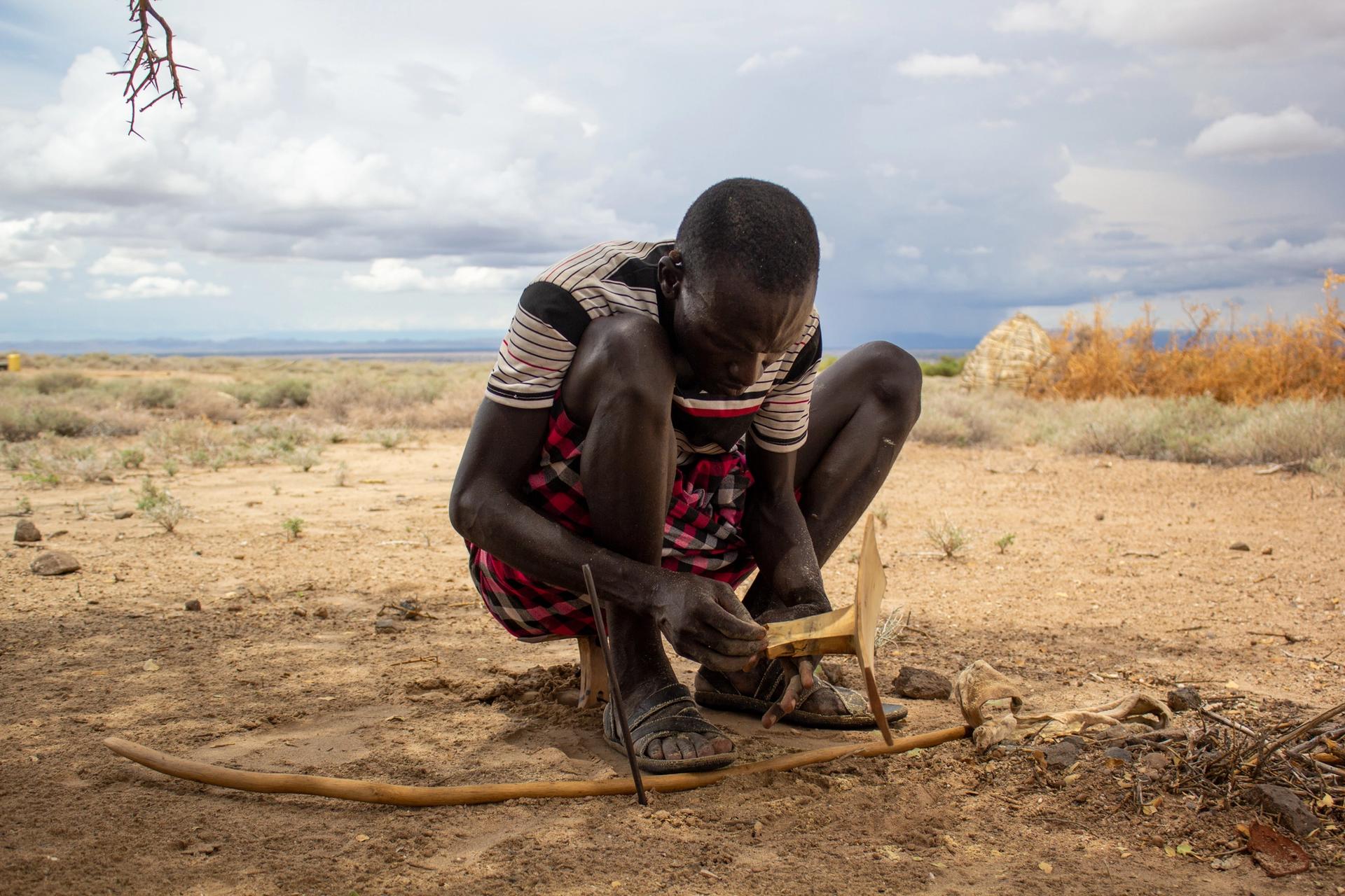 Kenyan tribesman Ewar Kulany making a Turkana ekichielong stool/headrest Photo: Samuel Derbyshire