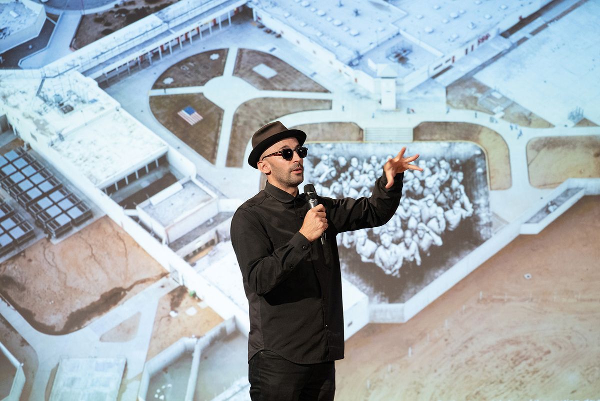 French street artist JR with his image of inmates at a maximum-security prison in California. The image forms part of a photo essay in The Lancet medical journal on the arts and health
Filip Wolak Photography, courtesy Jameel Arts & Health Lab