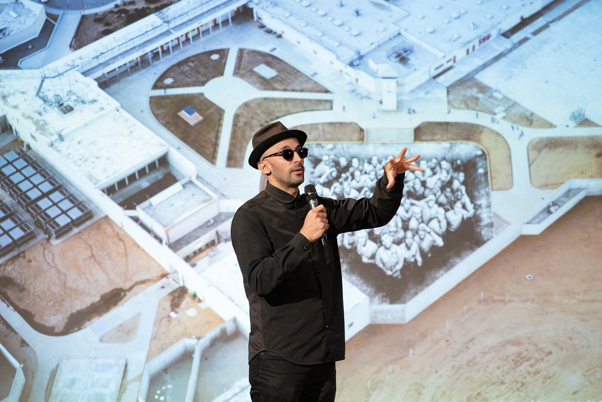 French street artist JR with his image of inmates at a maximum-security prison in California. The image forms part of a photo essay in The Lancet medical journal on the arts and health
Filip Wolak Photography, courtesy Jameel Arts & Health Lab