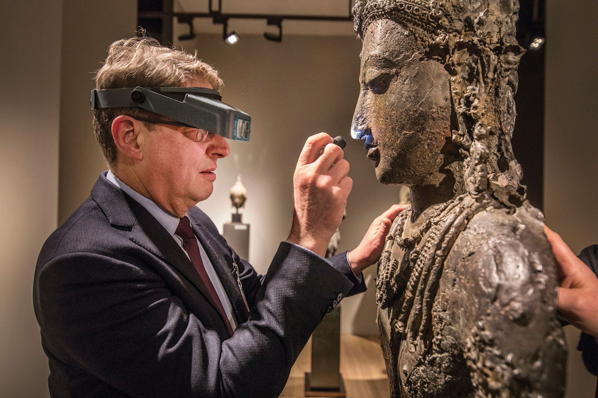 On the nose: an expert vets a sculpture for The European Fine Art Fair (Tefaf) Courtesy of Tefaf; Photo: Loraine Bowdewes