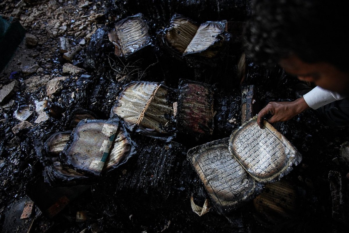 A pile of burnt books at the Azizia Madrasa library
Courtesy of Meer Faisal