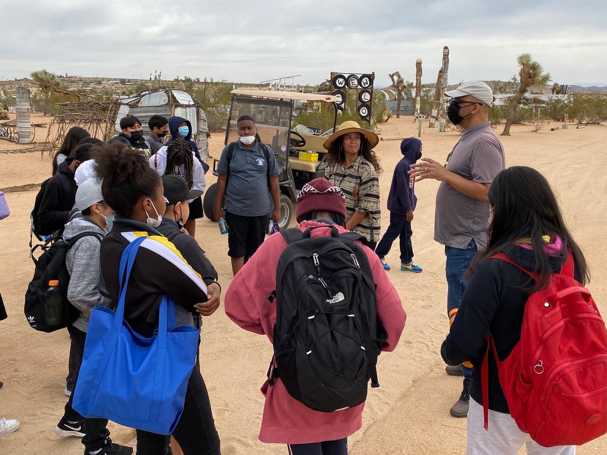 Visitors to the Noah Purifoy Outdoor Desert Art Museum in Joshua Tree, California Courtesy of Noah Purifoy Foundation