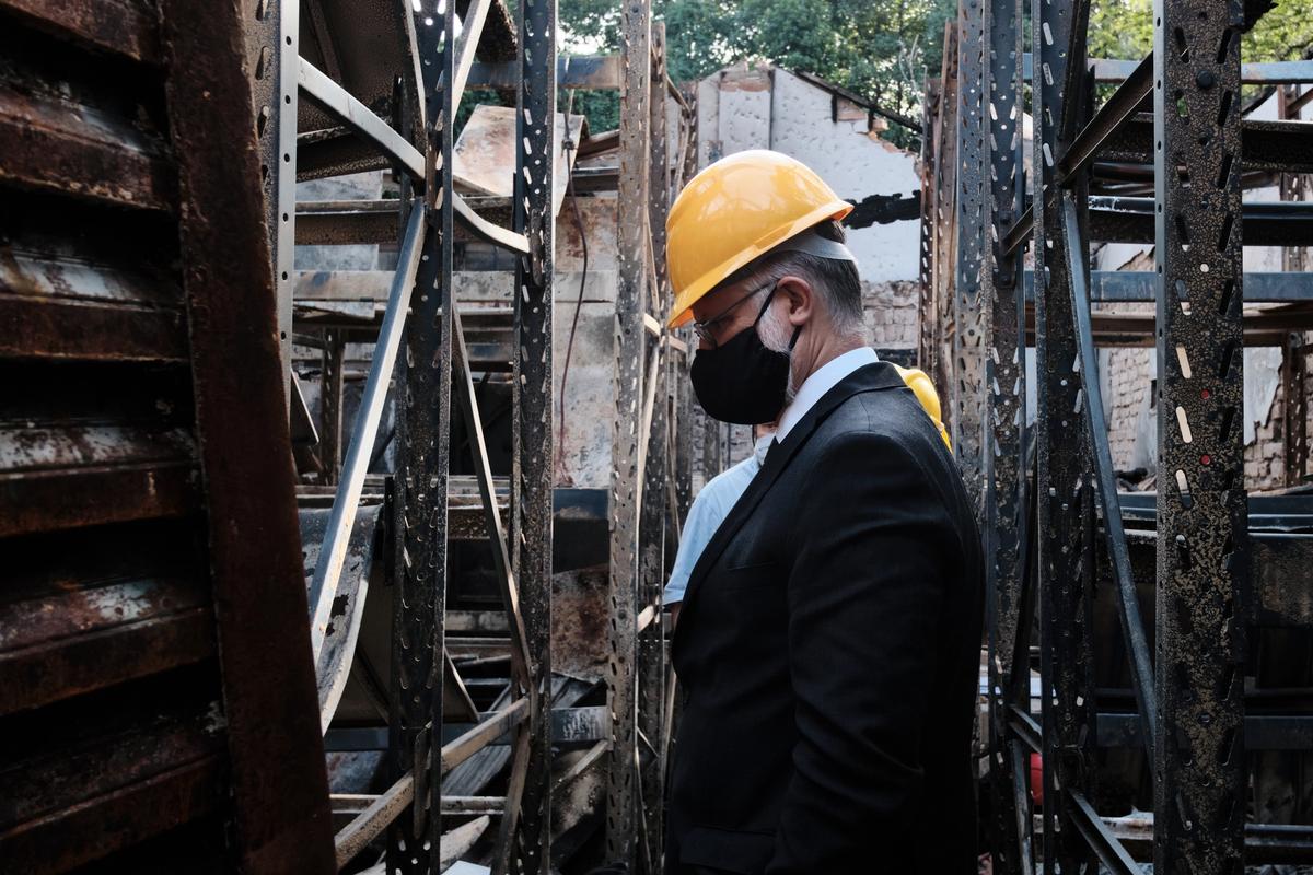 Museum officials survey the damage of a fire. Staff say that most of the collection is likely unsalvageable. Photo by Rogério do Pateo