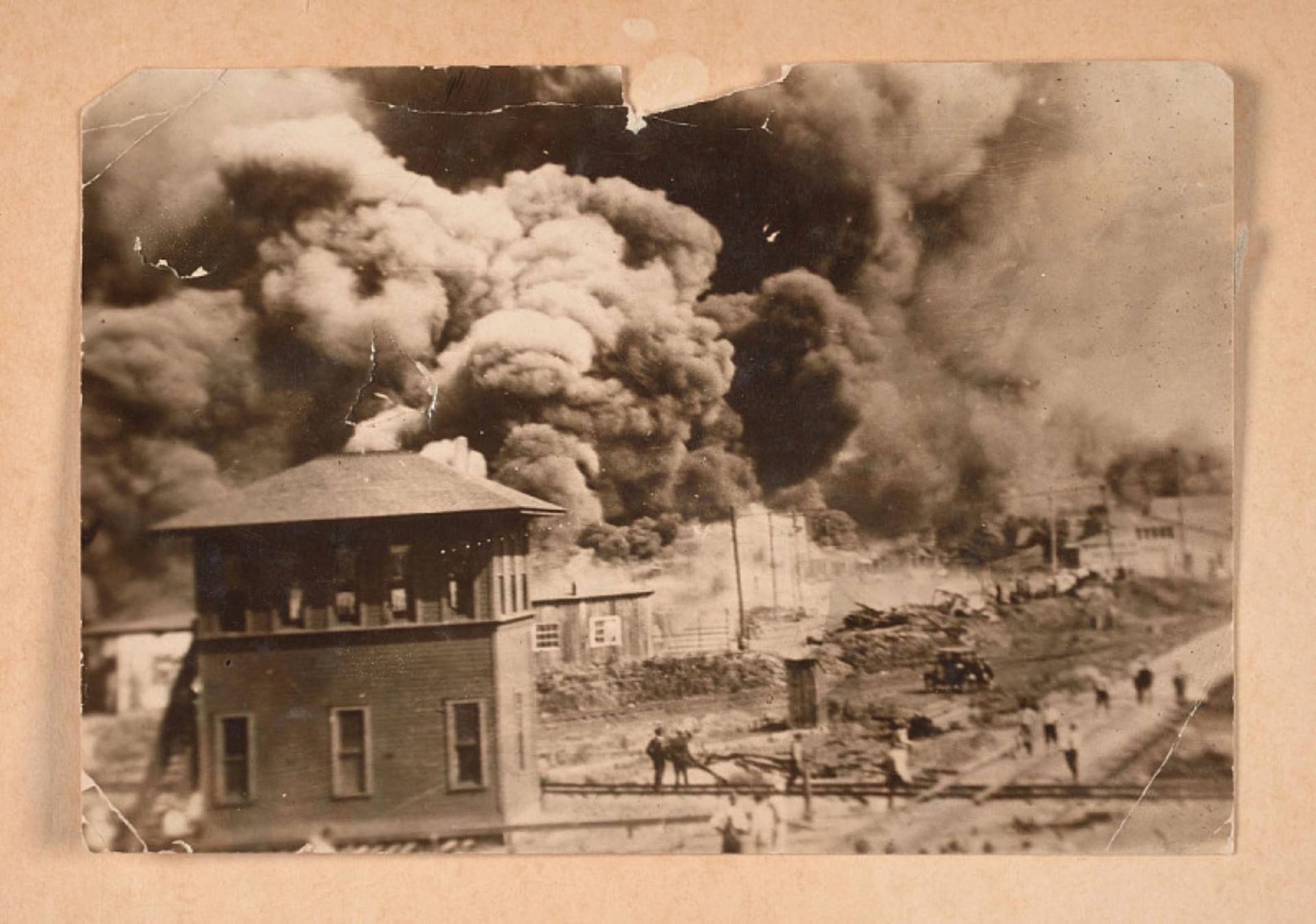 A 1921 photograph of the Greenwood District burning during the Tulsa Race Massacre Photo: Collection of the Smithsonian National Museum of African American History and Culture