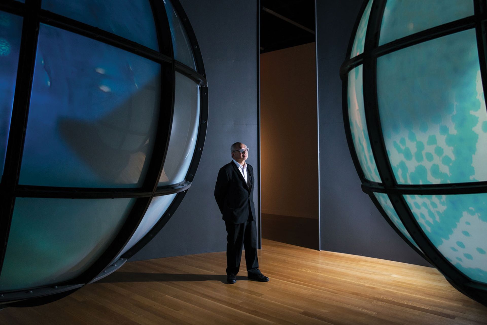 Mel Chin in front of his installation Sea to See (2014) Mint Museum