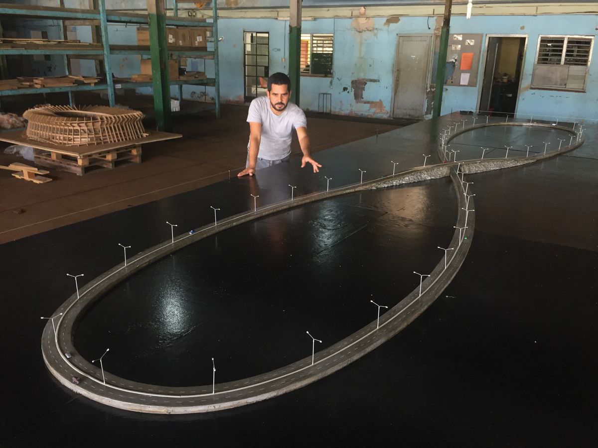 Wilfreo Prieto with his model of Viaje Infinito, which when complete will cover 490 acres Courtesy of Wilfredo Prieto