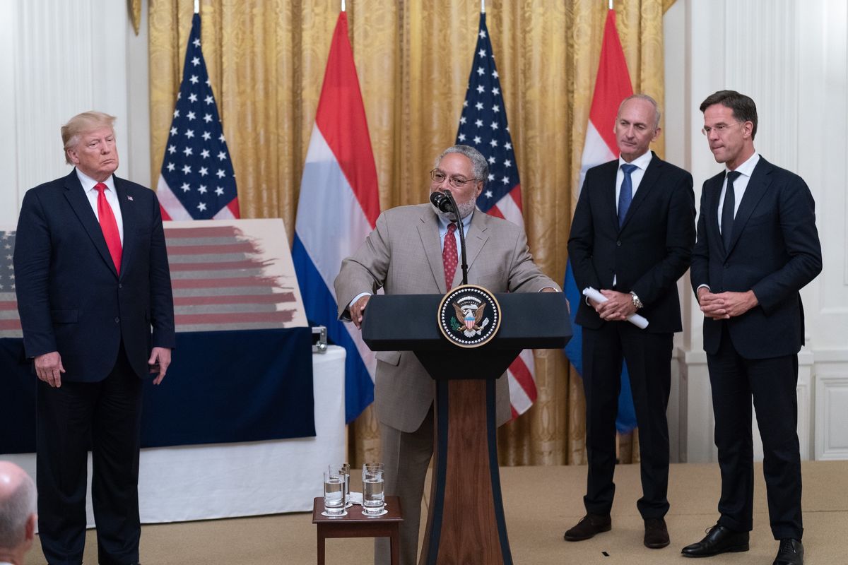 US president Donald Trump (left) looks on while Smithsonian Institution secretary Lonnie G. Bunch speaks during a 2019 ceremony at the White House Official White House Photo by Shealah Craighead, via Flickr