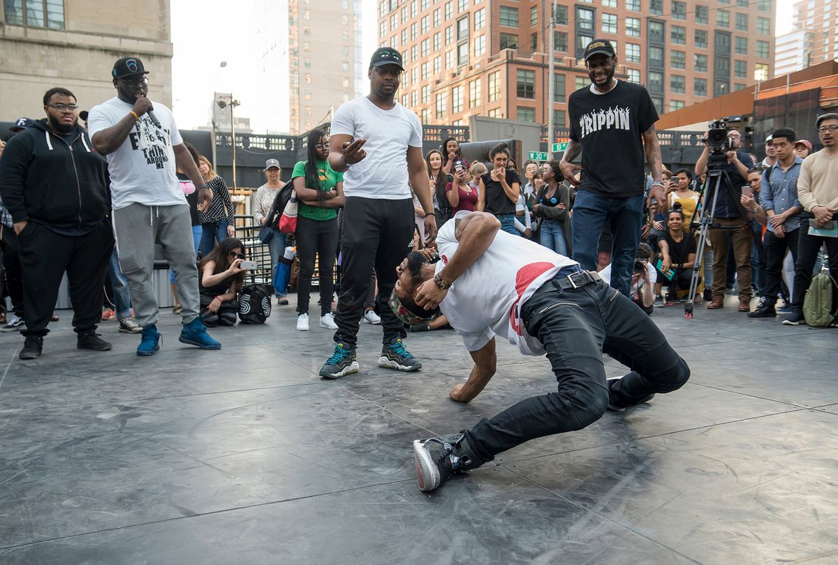 “Flexn” dancers and educators in The Shed’s pre-opening programme, FlexNYC: Reggie 'Reg Roc' Gray (holding mic); Dwayne 'Si Fi' Crichlow (centre standing); Cal Hunt (center dancing) and Steve A. Harvey aka Stickz (right) Photo: Stephanie Berger/The Shed