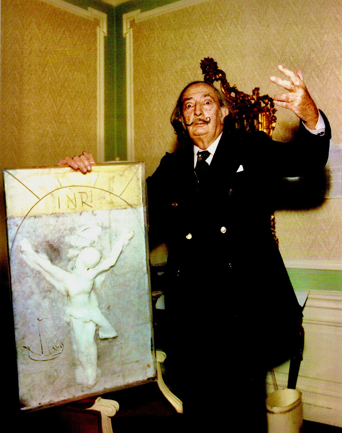 Salvador Dalí pictured with the original wax sculpture used to create his Christ of St. John of the Cross sculptures. Courtesy of Harte International Gallery