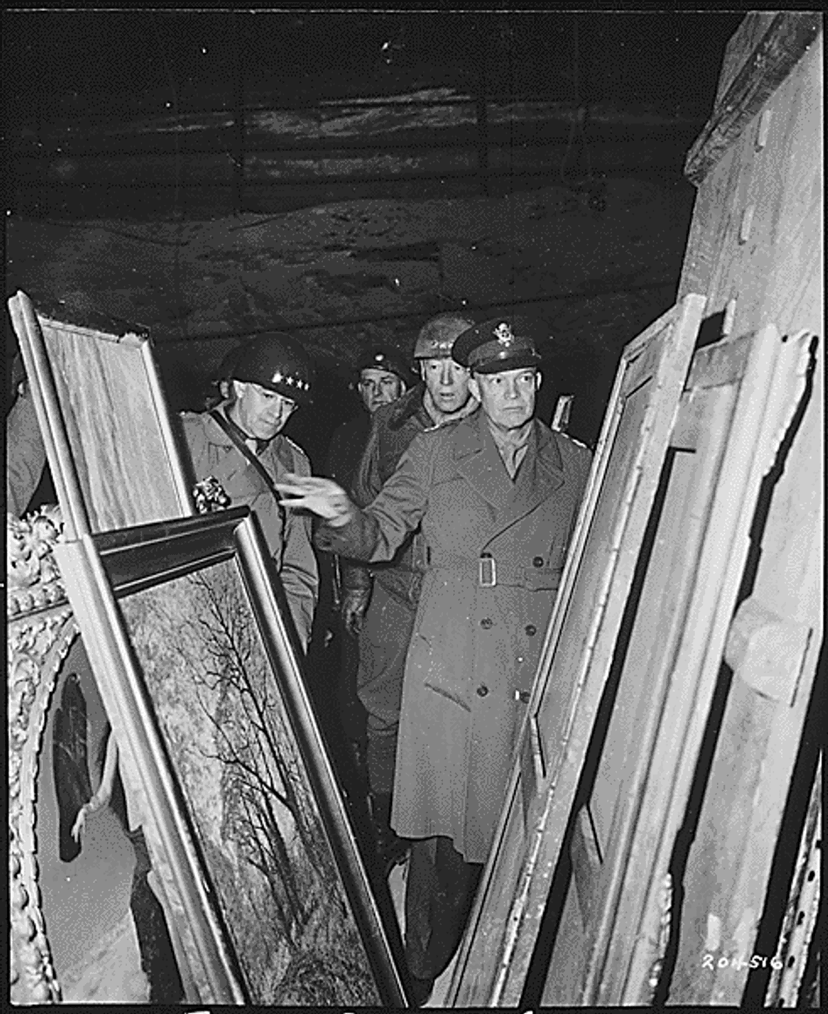 A photograph from 1945 showing General Dwight D. Eisenhower inspecting art stolen by Germans and hidden in a salt mine in Germany Photo: US National Archives