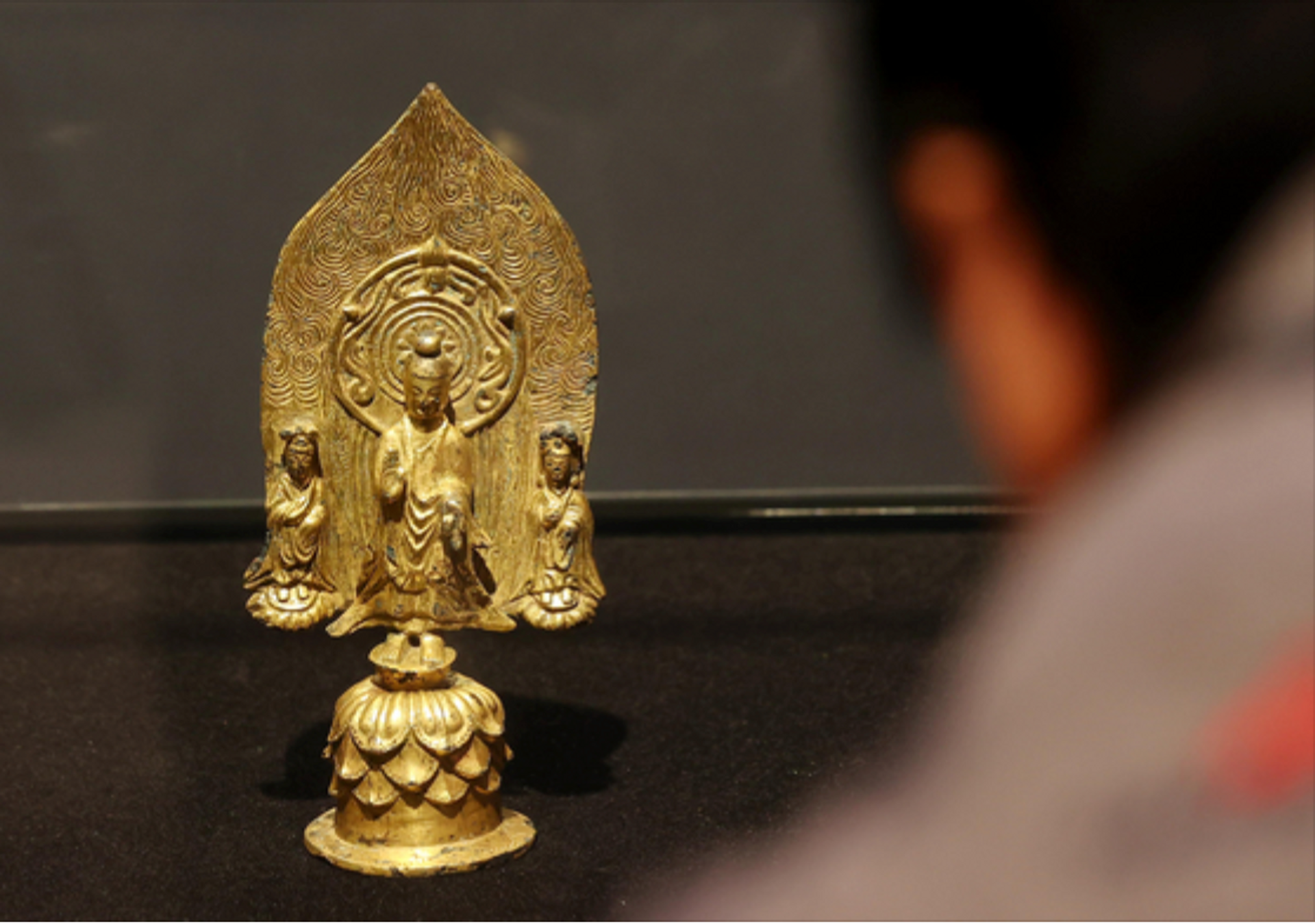 A sixth-century gilt-bronze Standing Buddha Triad with Inscription of "Gyemi Year" will be offered for sale by K Auction later this month. Courtesy of K Auction