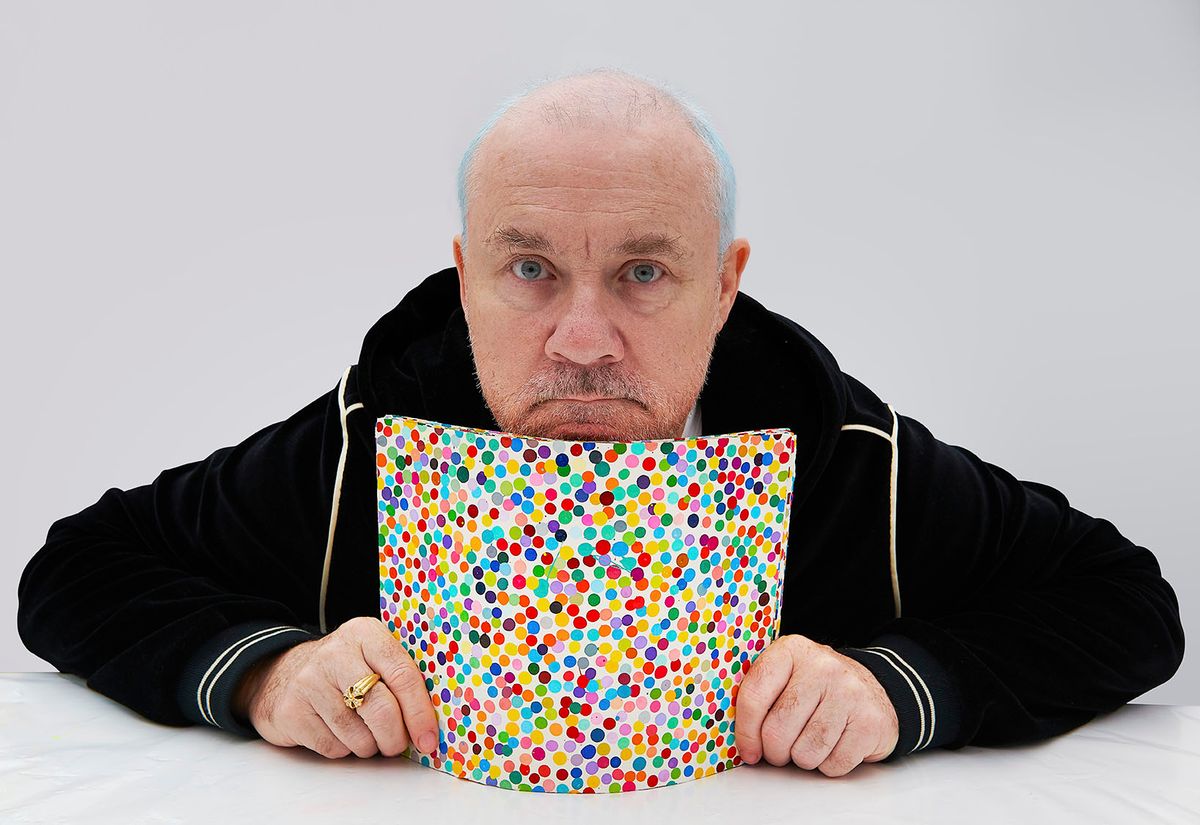 Damien Hirst with The Currency artworks in 2021. 
Photo: Prudence Cuming Associates Ltd. Courtesy of Damien Hirst and Science Ltd. All rights reserved, DACS 2022.