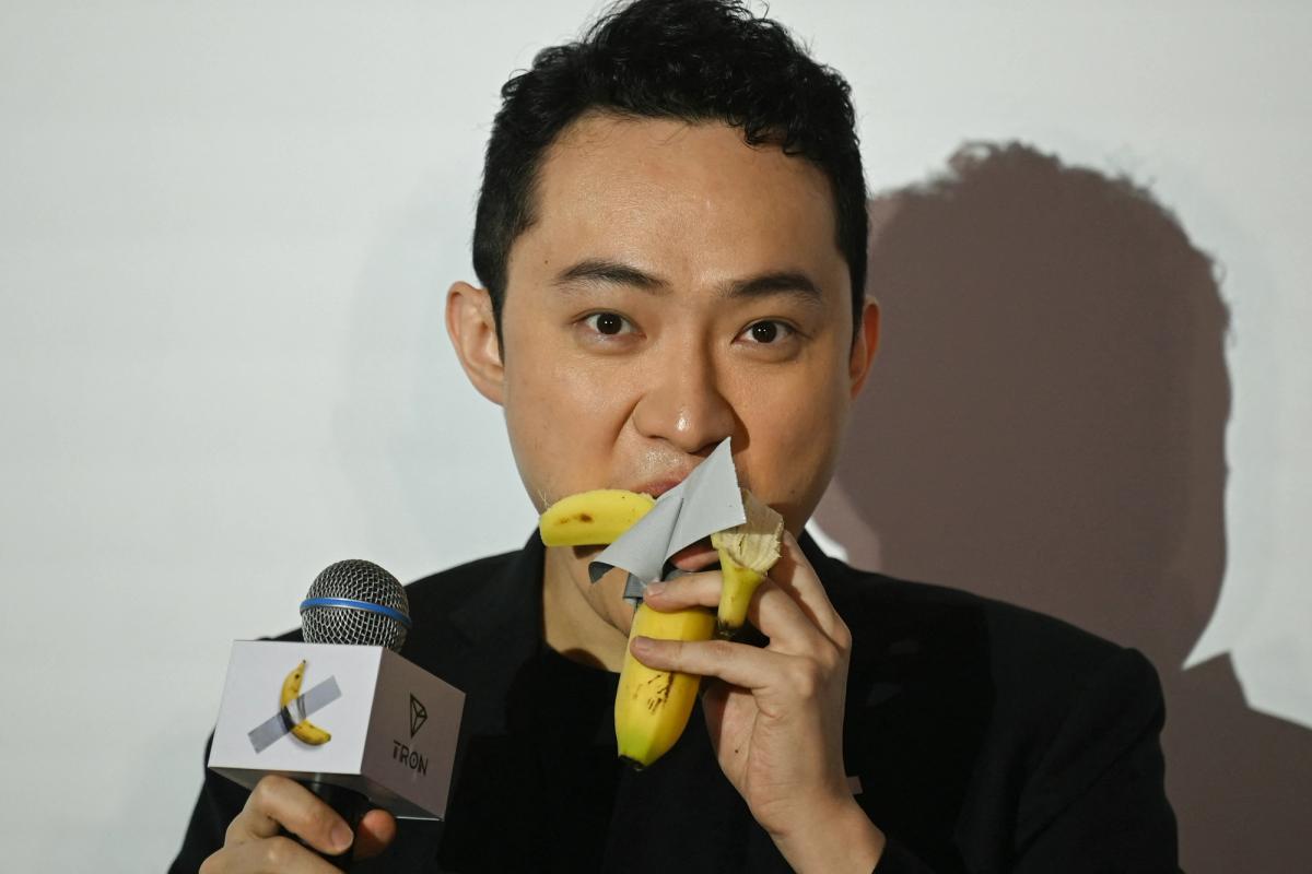 Sun took two bites out of the world's most expensive banana at a press conference in Hong Kong

Photo by PETER PARKS/AFP via Getty Images

