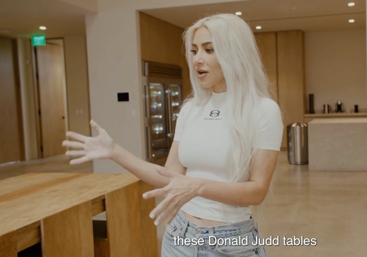 Kim Kardashian showing off tables in her company's offices in the style of Donald Judd Screenshot via YouTube