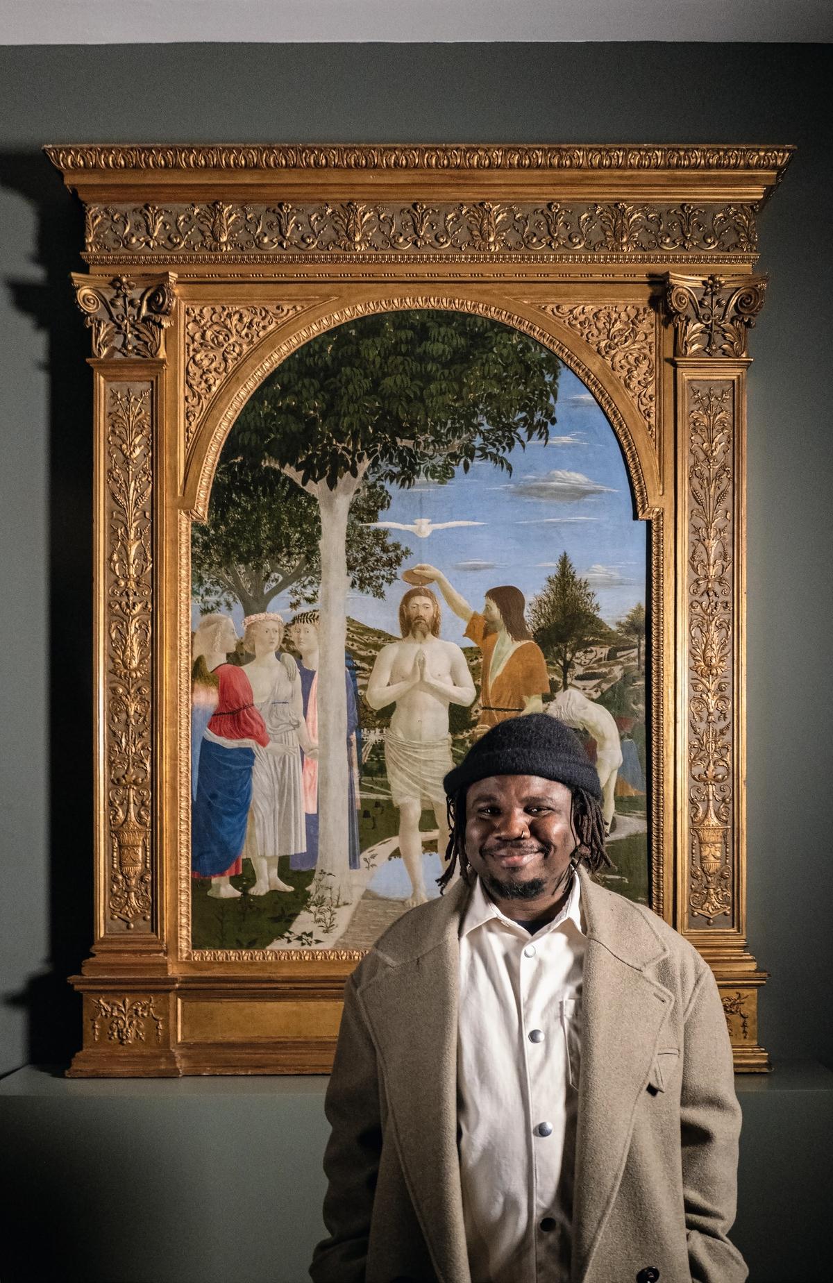 Alvaro Barrington in front of Piero della Francesca’s The Baptism of Christ (1437-45) Photo: David Dawson
