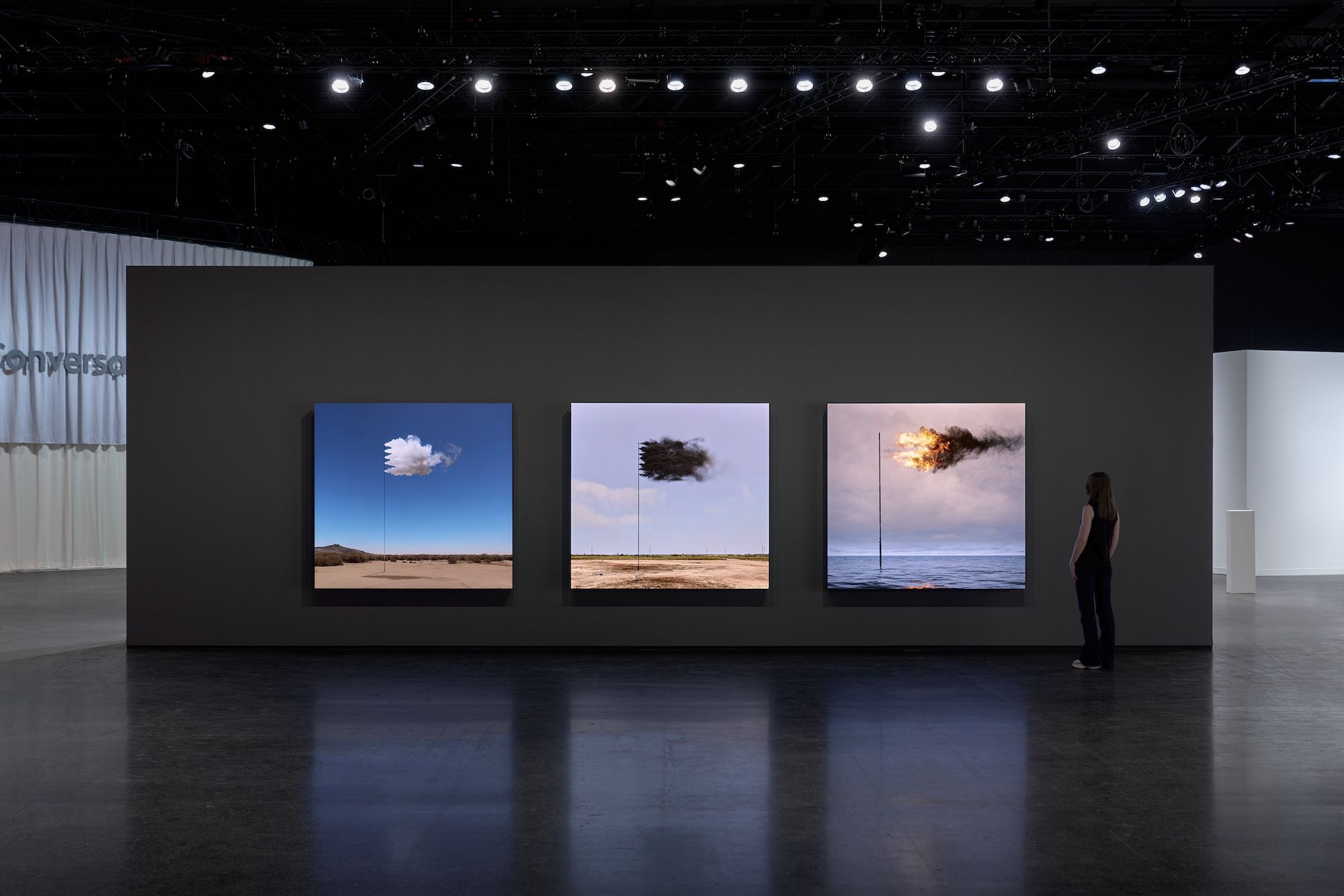 John Gerard's works (left to right) STANDARD (2023), Western Flag (Spindletop, Texas) (2017) and Flare (Oceania) (2022) on display at Fellowship's stand in Zero 10 at Art Basel Photo by Reece Straw, courtesy Fellowship