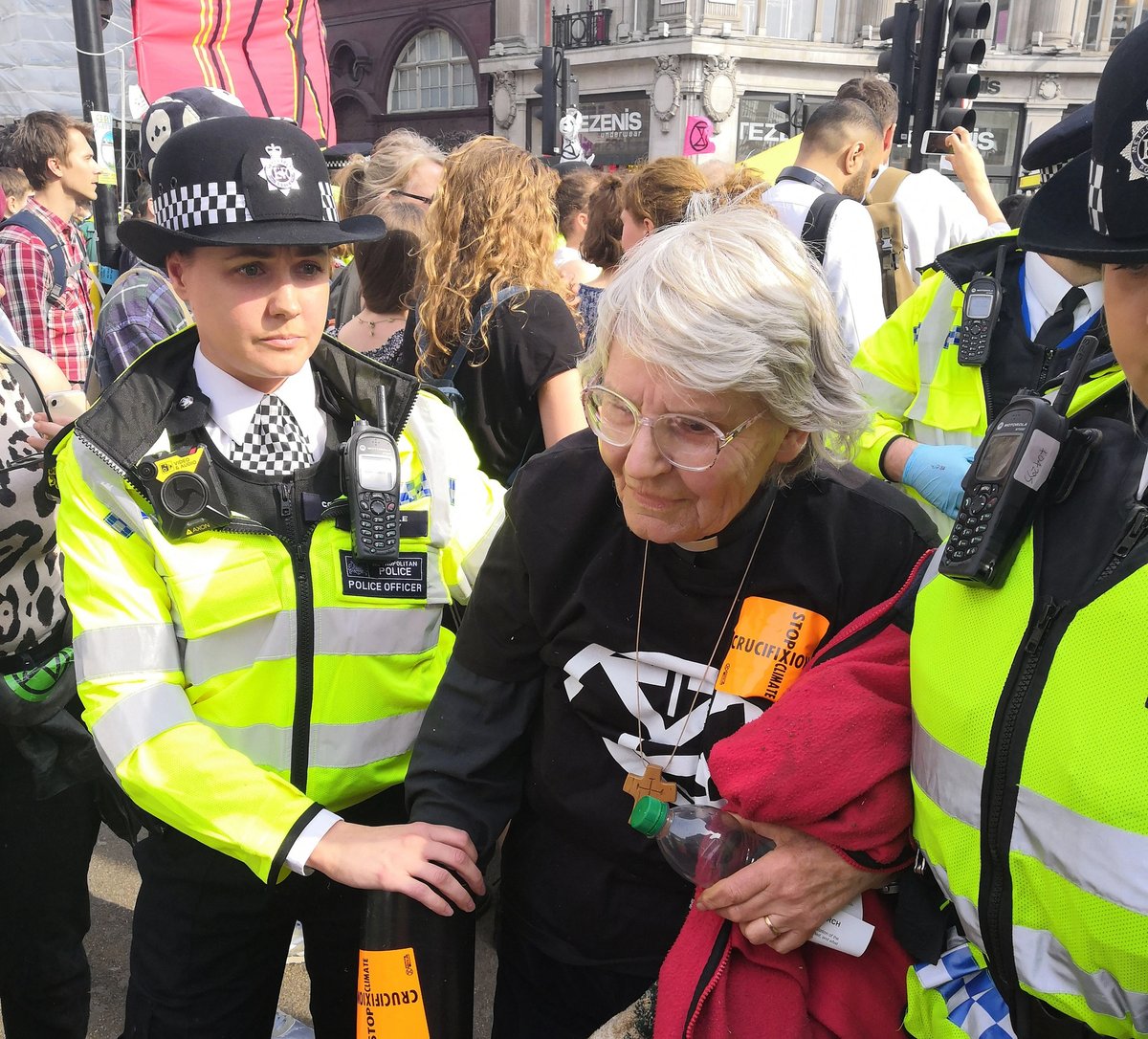 Sue Parfitt is led away by police for lying in the road at Oxford Circus during the 2019 Extinction Rebellion protests in London. Charged under the Public Order Act, she was found guilty and given a conditional discharge
© Christian Climate Action