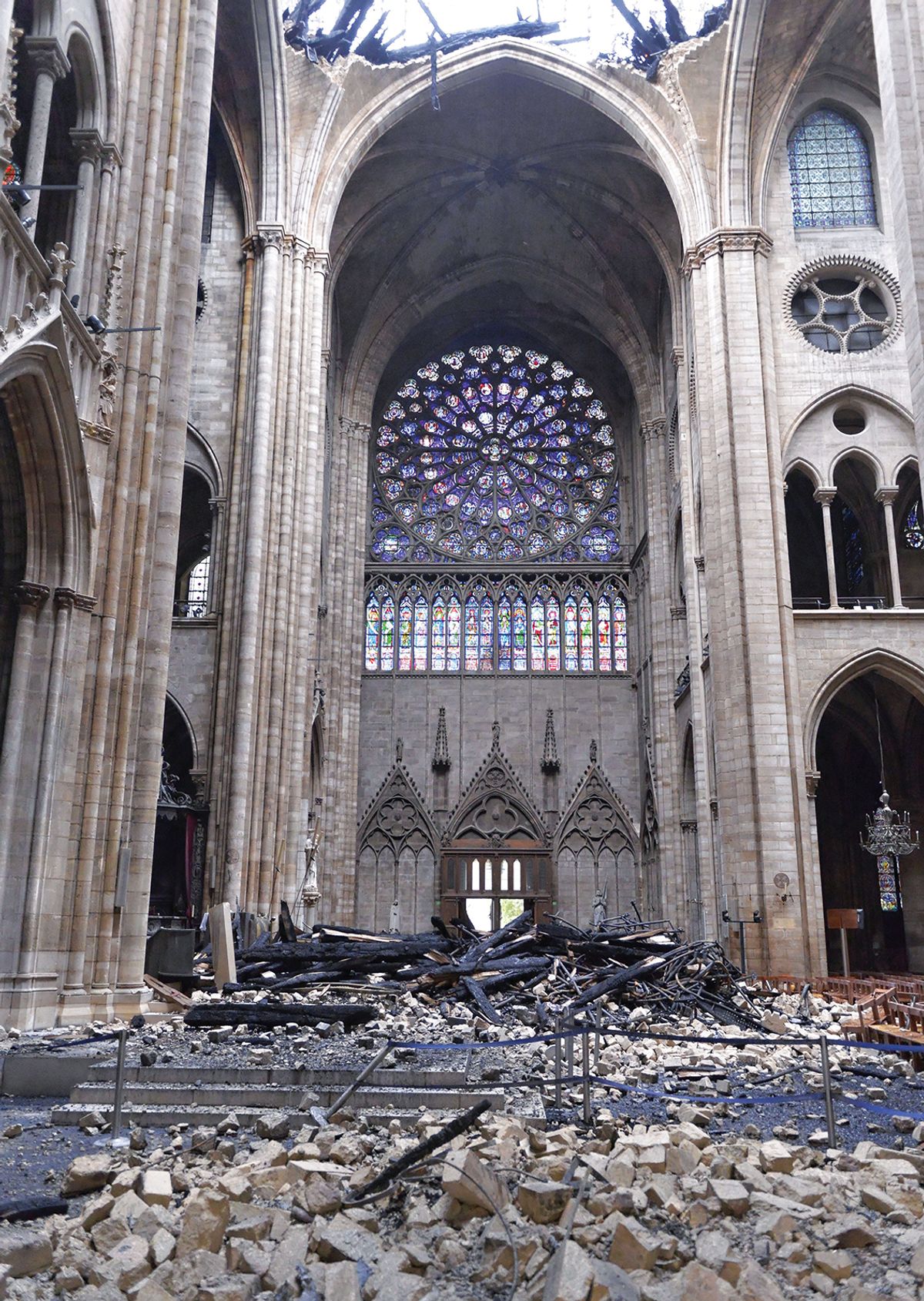 Debris inside Notre Dame after the catastrophic fire; the rose window appears to be intact, but the glass may have suffered from micro-cracks, requiring time-consuming repairs Photo: Bastien Louvet/SIPA/REX/Shutterstock; © 2019 Shutterstock