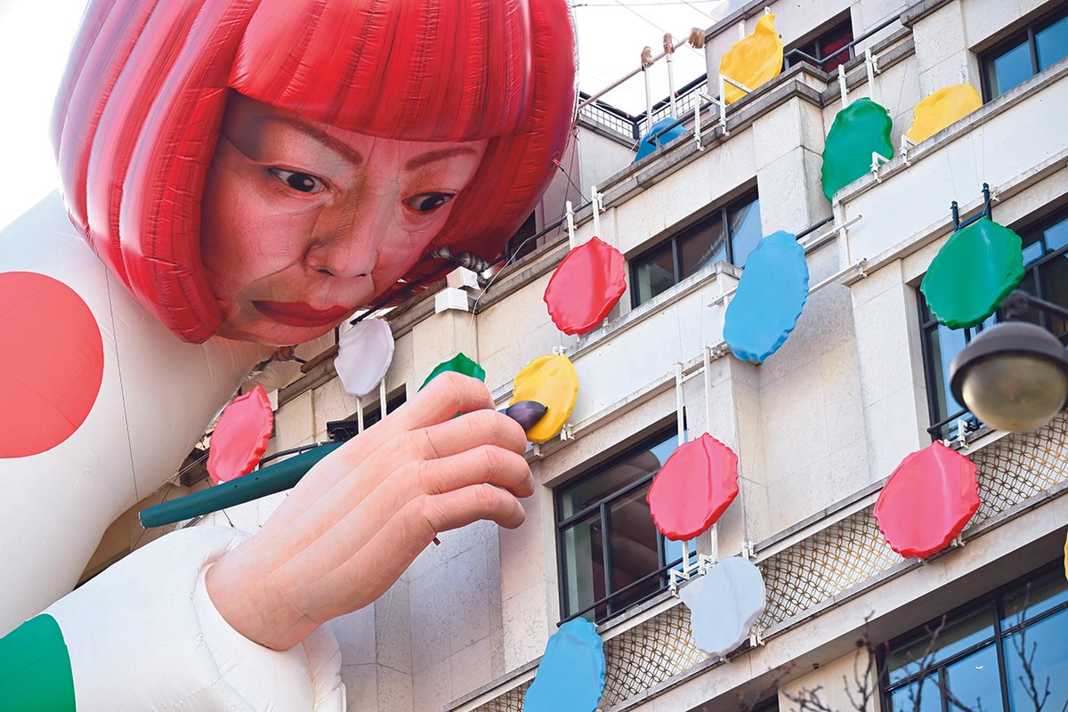 A large inflatable mannequin depicting Japanese contemporary artist Yayoi Kusama decorating the French luxury brand Louis Vuitton flagship store on the Champs-Elysees avenue in Paris
Photo: Emmanuel DUNAND / AFP
