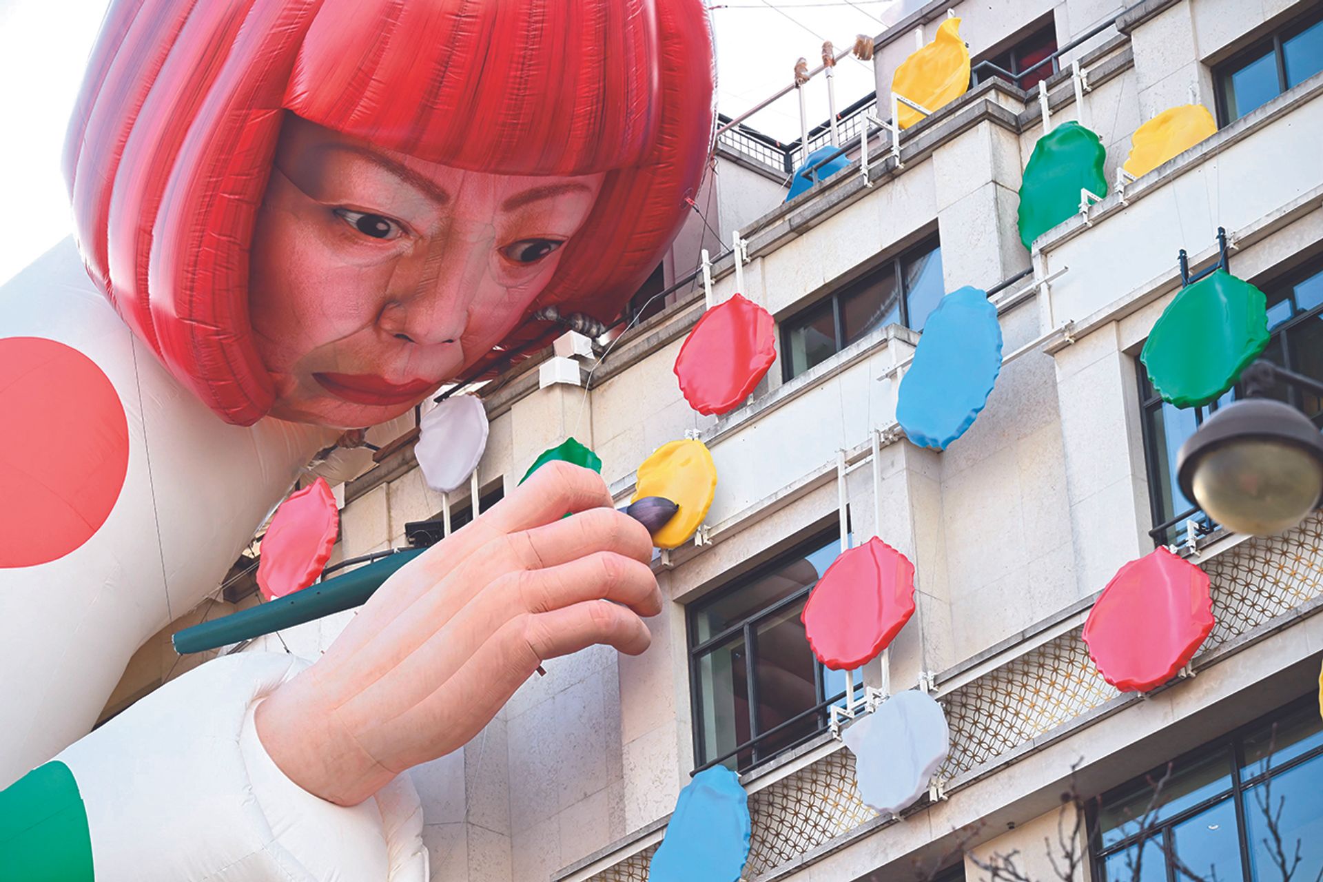 A large inflatable mannequin depicting Japanese contemporary artist Yayoi Kusama decorating the French luxury brand Louis Vuitton flagship store on the Champs-Elysees avenue in Paris

Photo: Emmanuel DUNAND / AFP