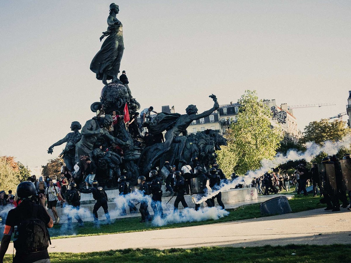 Protesters in Paris face riot police during a nationwide strike on 18 September against planned spending cuts
Photo: Astien Ohier/Hans Lucas/AFP via Getty Images