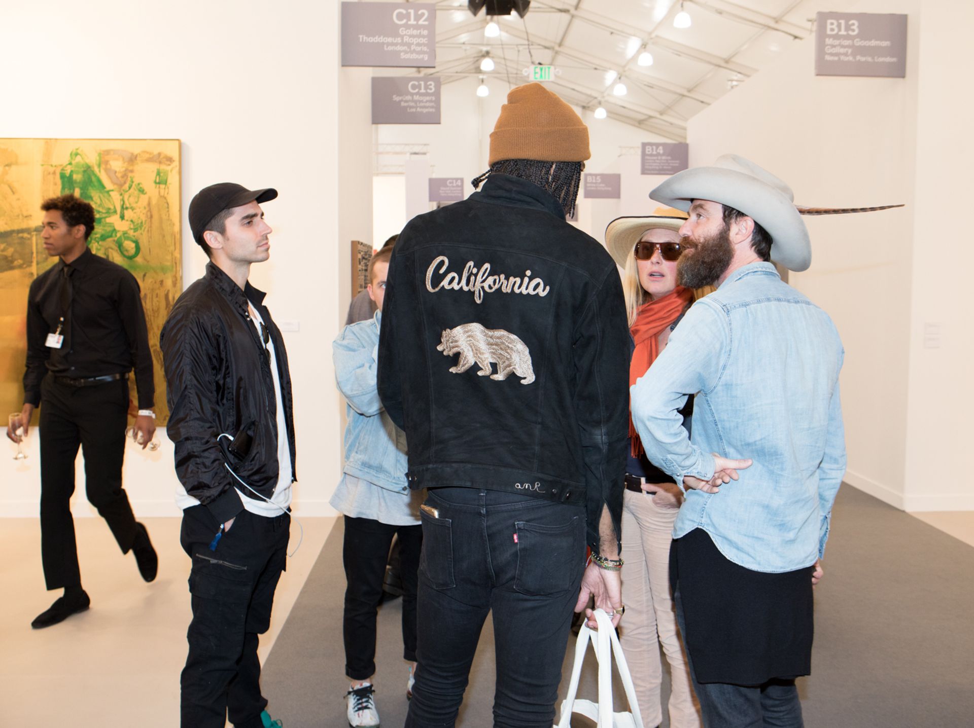 Fair visitors chat outside of Thaddaeus Ropac's booth at the second edition of Frieze LA. © David Owens