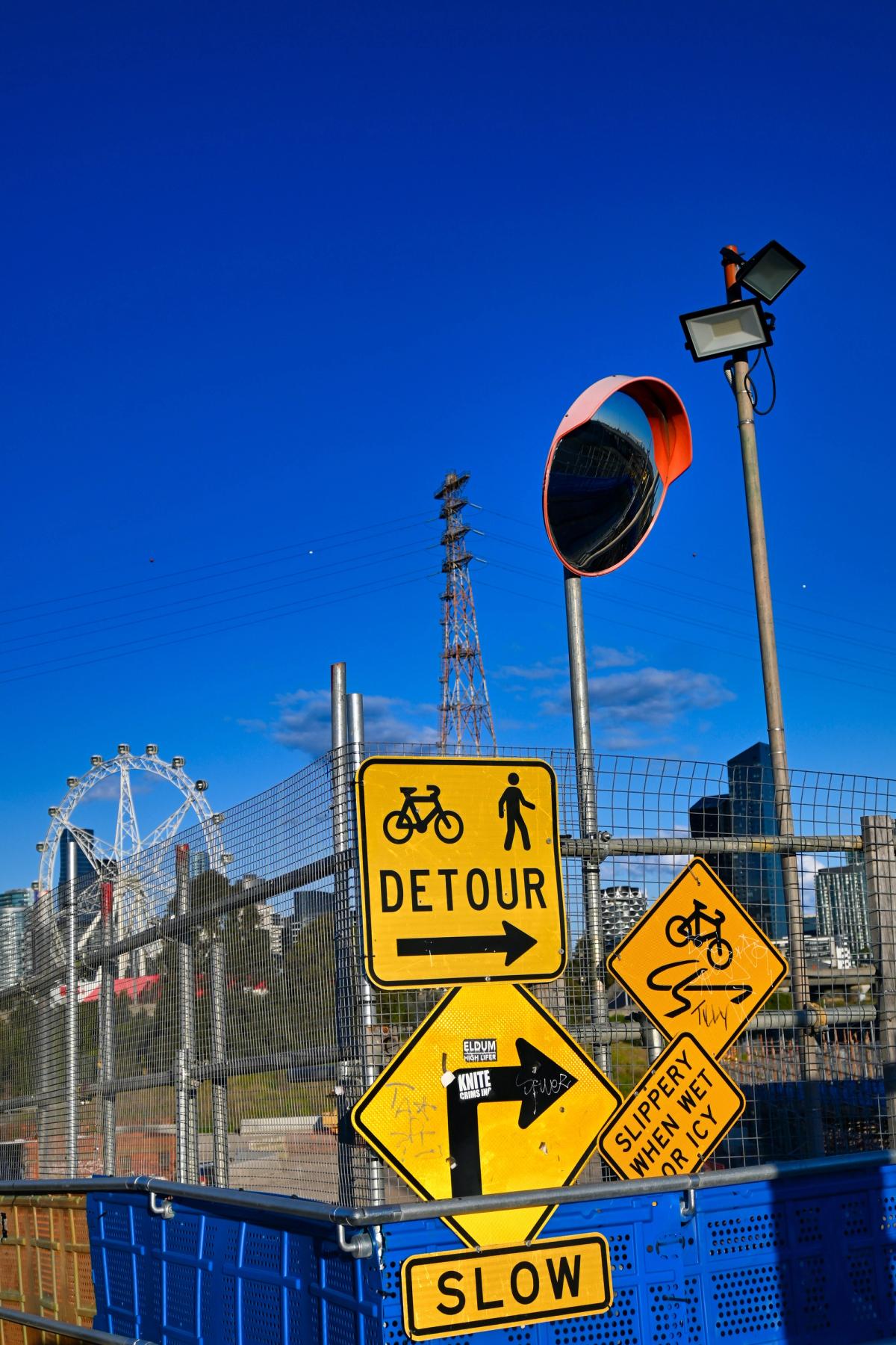 Detour signs in front of a fenced-in amusement park
Photo by Enguerrand Blanchy on Unsplash