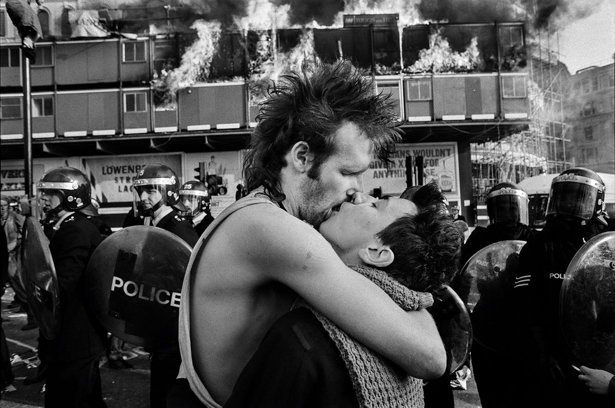 Love among the turbulence: David Hoffman’s photograph Nidge & Laurence Kissing (1990), taken during the poll tax riots in London © David Hoffman