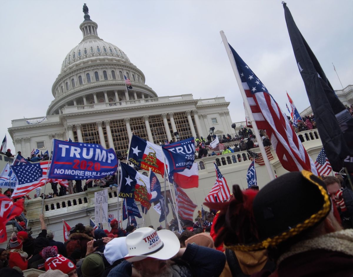 Demonstrators outside the US Capitol building in Washington, DC during the 6 January 2021 insurgency Photo by Tyler Merbler, via Flickr