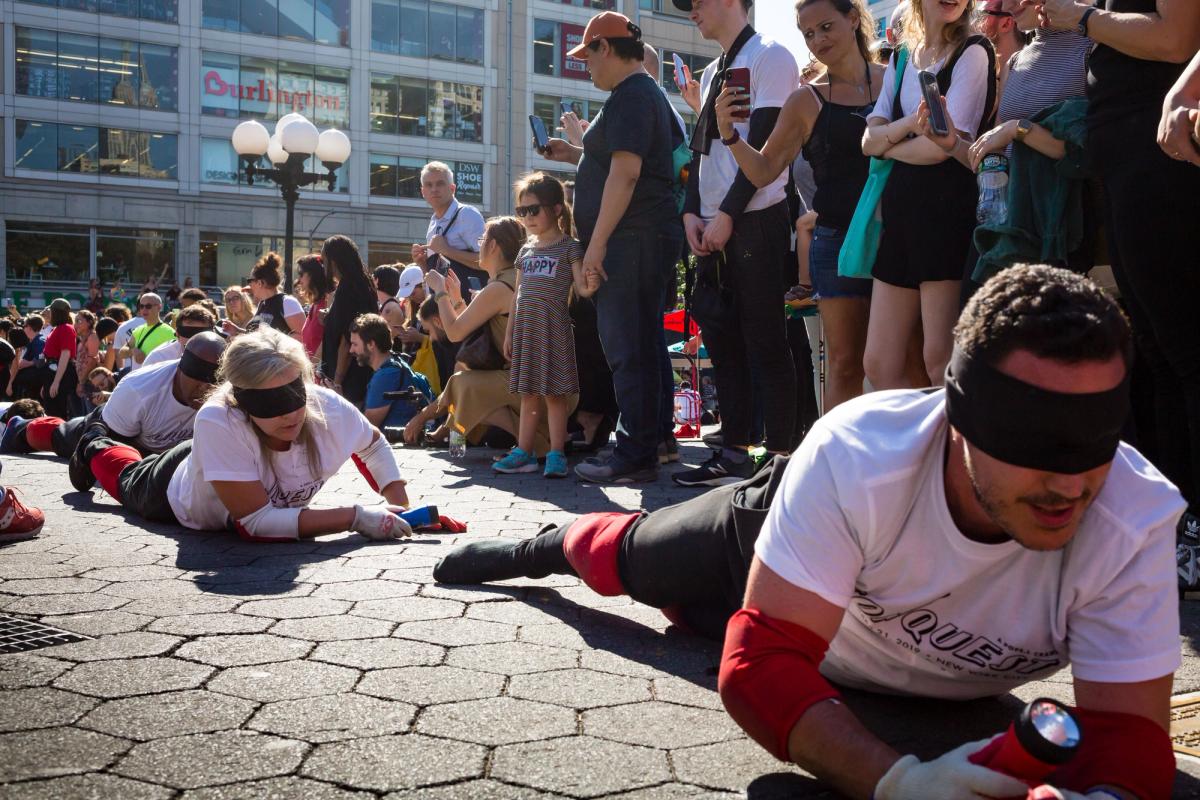Pope.L, Conquest (2019), a group crawl in New York featuring 140 participants, 5-hour duration, commissioned by Public Art Fund © Pope.L Photo by Nicholas Knight, courtesy of the artist and Public Art Fund, NY