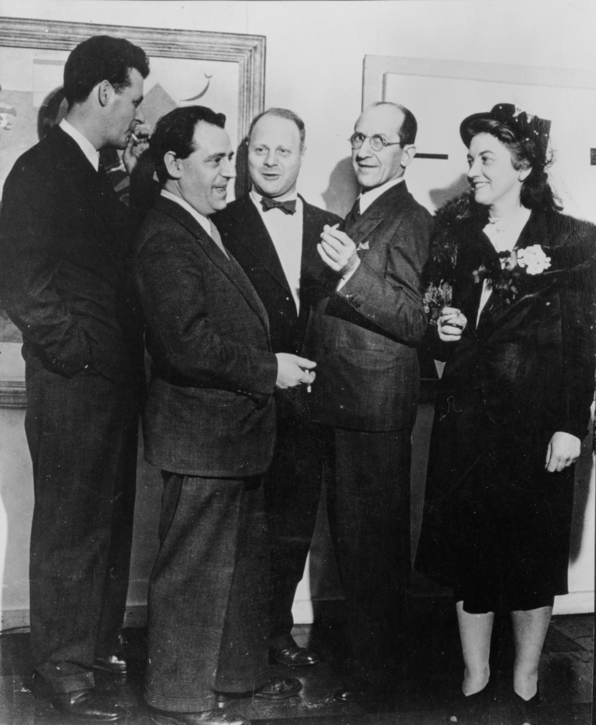 Piet Mondrian (second from right) at an exhibition opening in New York in 1942 