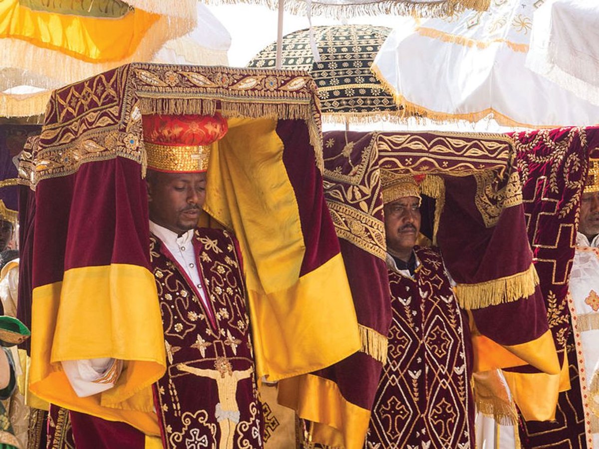 Priests in Addis Ababa carrying covered tabots on their heads during a celebration of the Epiphany © Jean Rebiffé