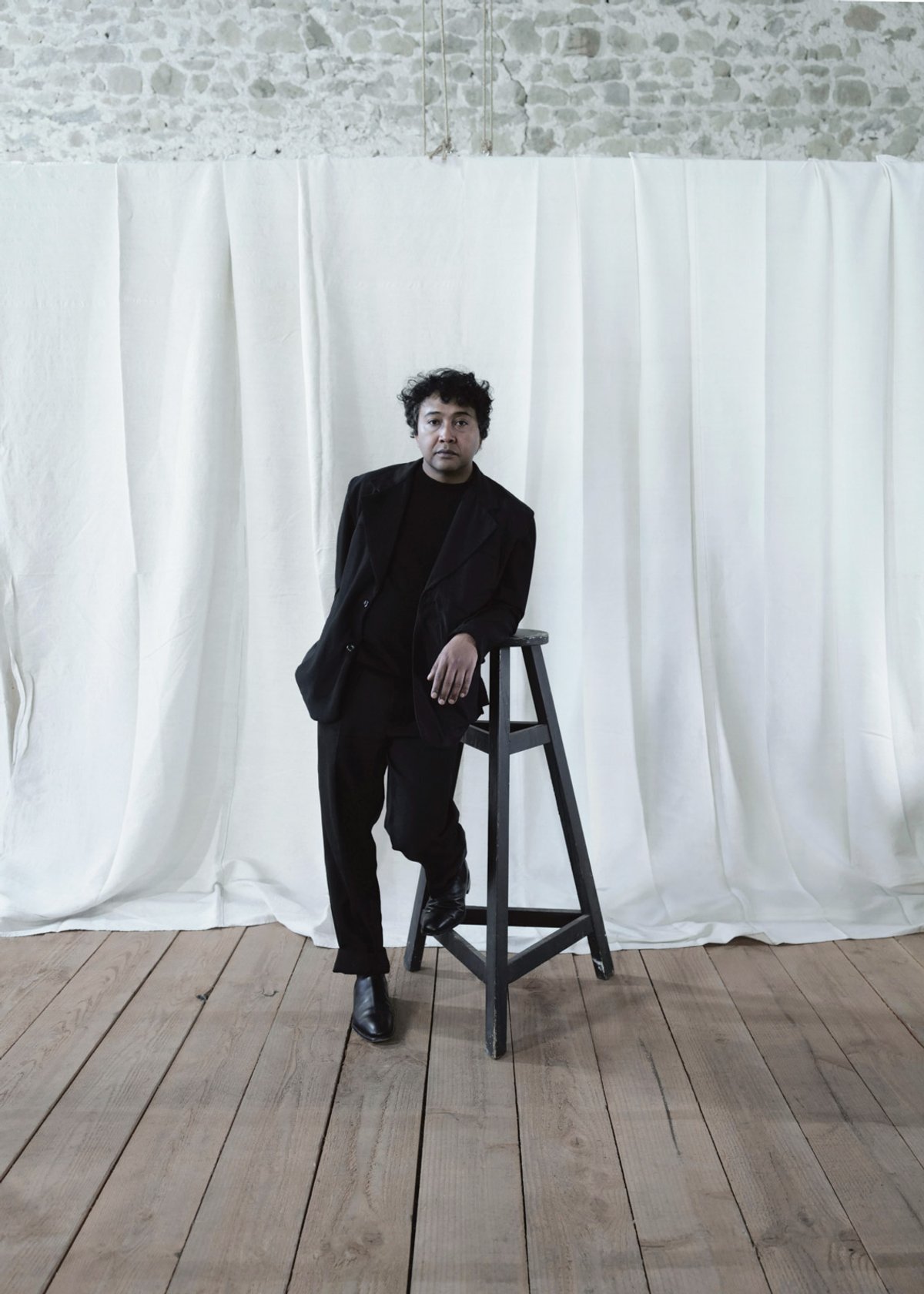 Andrianomearisoa, in trademark black, which he say is “not only a colour, but also an attitude” Courtesy of the artist and studio Joël Andrianomearisoa