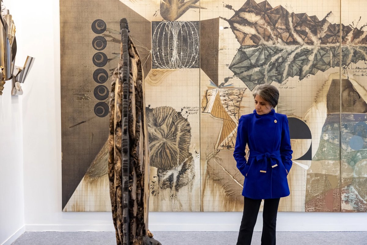 A visitor at Chemould Prescott Road's stand at India Art Fair 2024
Courtesy of India Art Fair