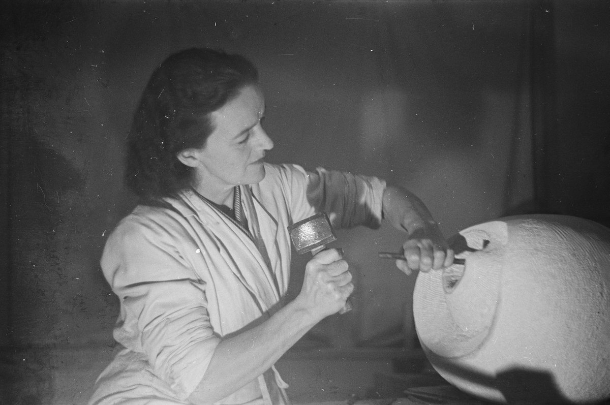 Barbara Hepworth at work on the stone carving Eidos (1947-48). Taken in her studio in St Ives, Cornwall 
© Bowness