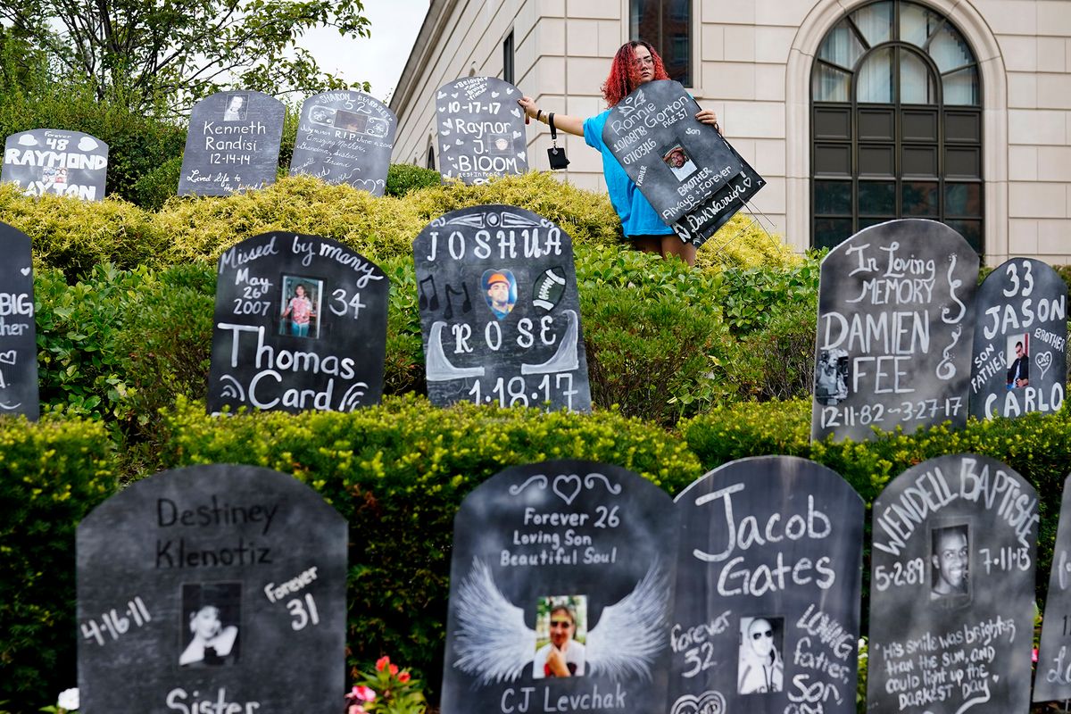 Cardboard tombstones honouring opioid overdose victims, arrayed by protesters outside a federal courthouse in White Plains, New York Associated Press