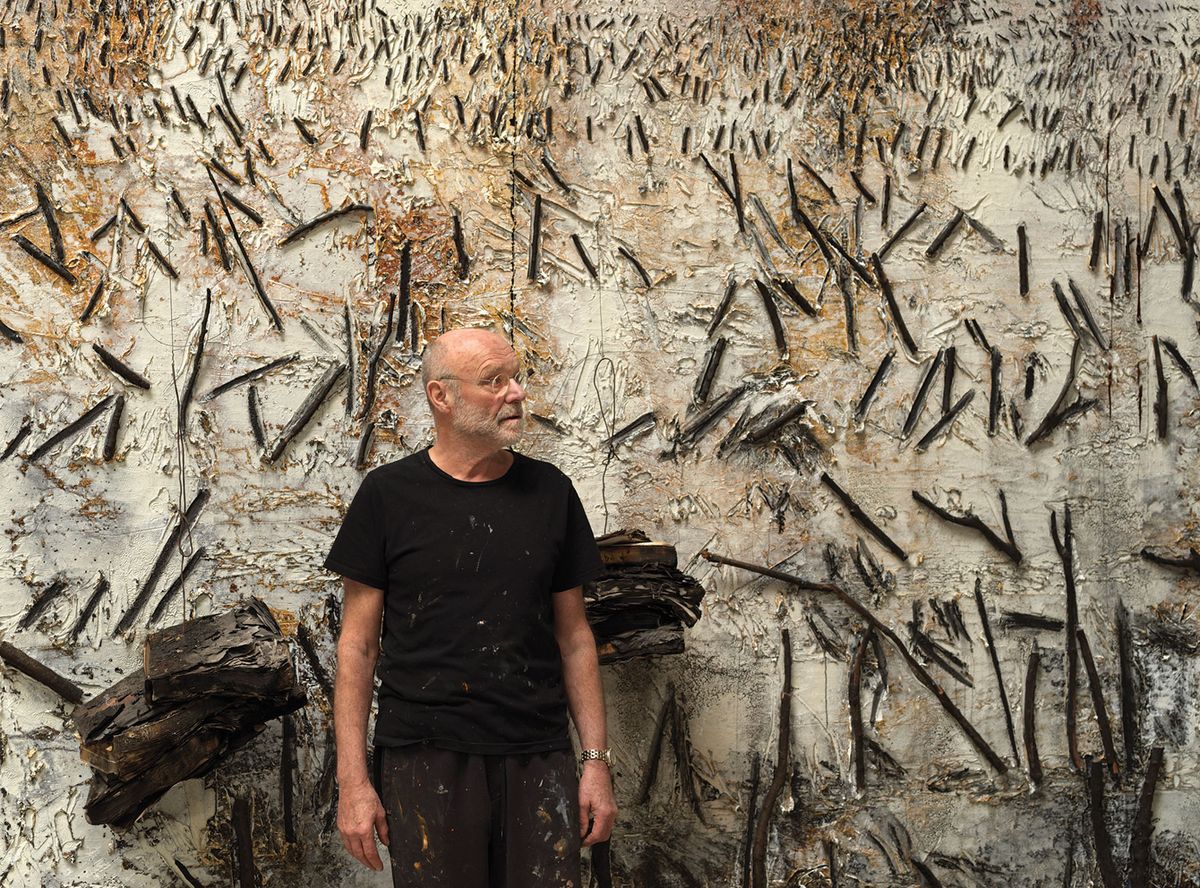 Anselm Kiefer with one of the monumental paintings he created for the Palazzo Ducale using Venetian motifs to express themes of creation, destruction and transformation © Georges Poncet