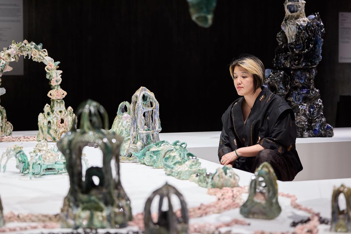 Heidi Lau with her work at the Sigg Prize 2025 exhibition
Photo: Dan Leung. Courtesy of M+, Hong Kong