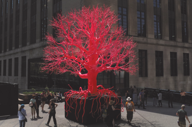 High Line Red Tree A hot pink tree sculpture sprouts amid New York's leafy High Line