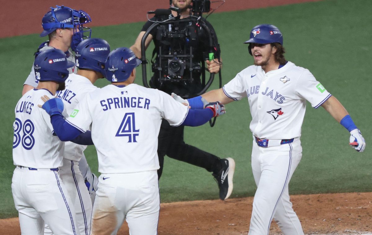 Toronto Blue Jays player Addison Barger (right) is greeted by teammates after hitting a grand slam home run in the first game of the 2025 World Series against the Los Angeles Dodgers on Friday 24 October Photo by Aaron Josefczyk/UPI Credit: UPI/Alamy Live News