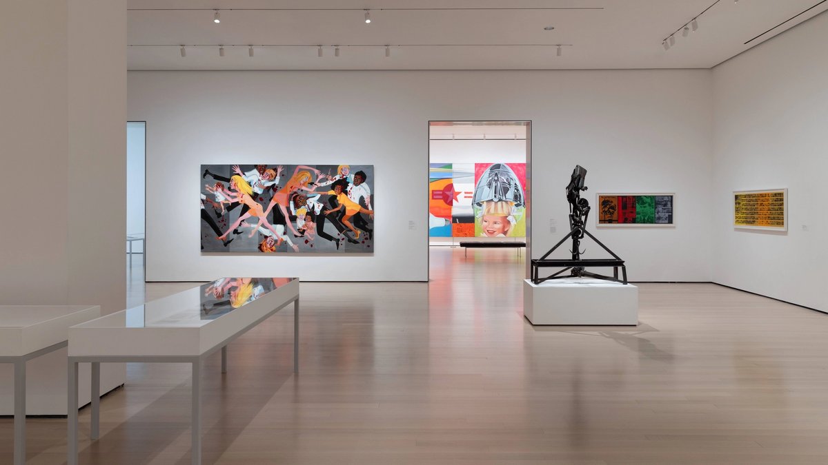 An installation view from inside the Museum of Modern Art with Faith Ringgold’s American People Series #20: Die (1967) visible at the back left
The Museum of Modern Art, New York. © Faith Ringgold / Artists Rights Society (ARS)