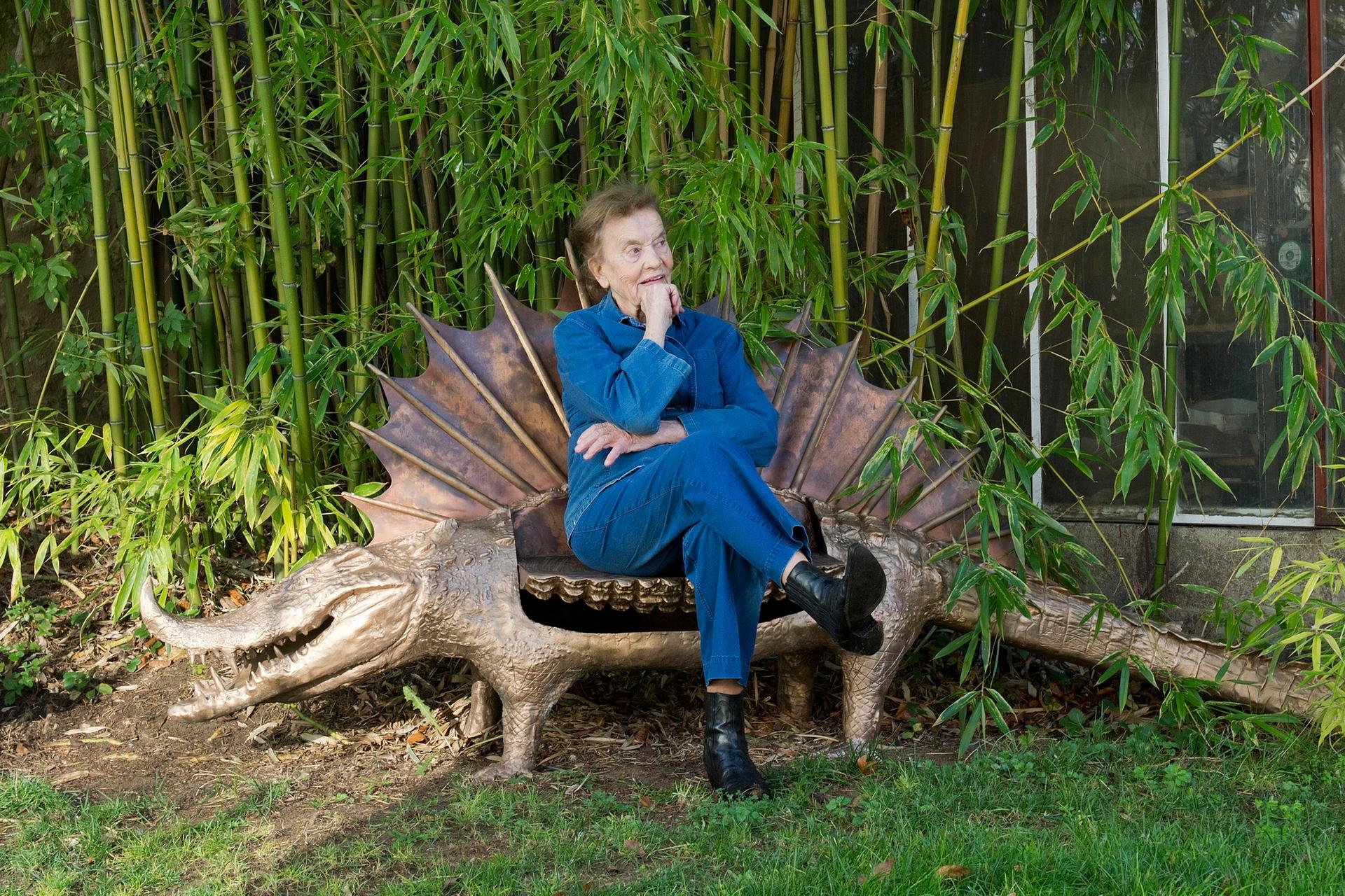 Claude Lalanne sitting on one of her Crocodile benches Photo: ©Luc Castel