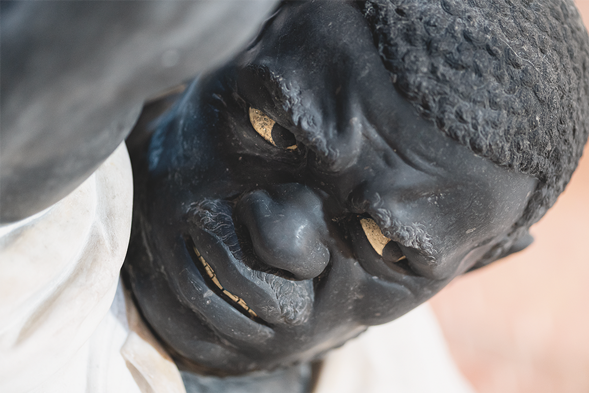 Head of a black man holding up the tomb of Doge Giovanni Pesaro, designed by Baldassare Longhena, 1665-69. In the defence of Candia (modern Herakleion), the Venetians defeated the Ottomans at sea and African galley slaves were among their prisoners. Basilica of the Frari © Toto Bergamo Rossi