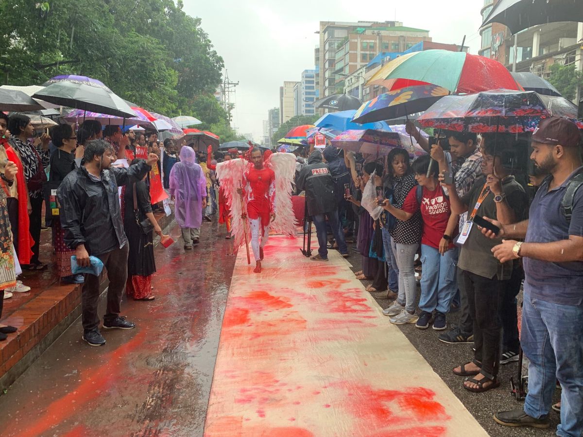 Artists wrote the names of those who had died at the hands of the regime in red paint; the rains turn them into a blood-red wash Courtesy of Amirul Rajiv