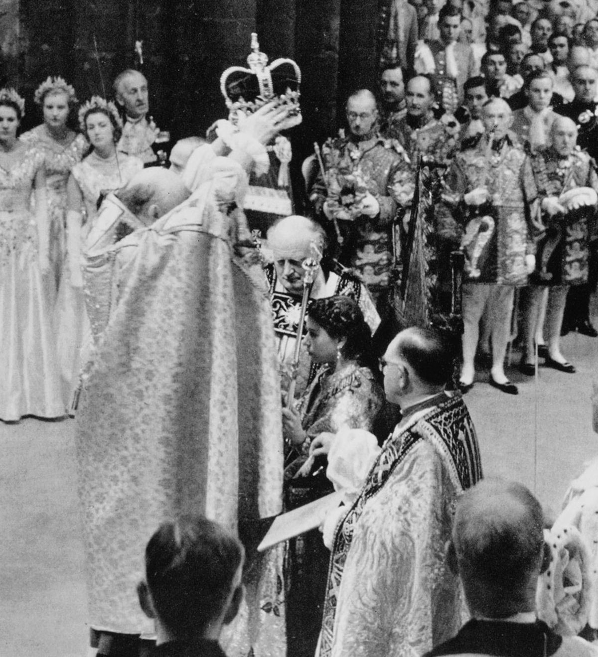 The moment of coronation: the Archbishop of Canterbury, Geoffrey Fisher, prepares to place St Edward's Crown on the head of Queen Elizabeth II, 1953 Royal Collection Trust / © His Majesty King Charles III 2023