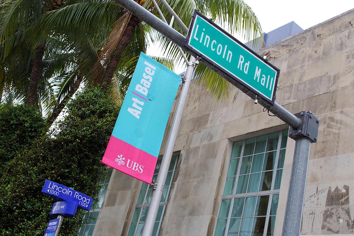 Signage on Lincoln Road Miami Beach advertising the upcoming Art Basel event. iStock