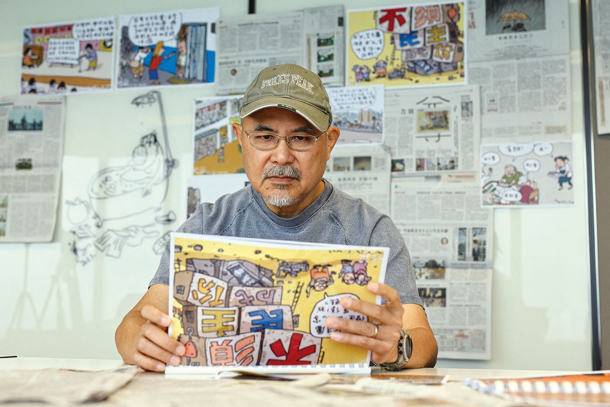 The satirical cartoonist Wong Kei-kwan, who uses the pen name Zunzi, had his comic strip in the Hong Kong newspaper Ming Pao cancelled following government pressure, but he continues to live in the city Photo: Reuters/Tyrone Siu