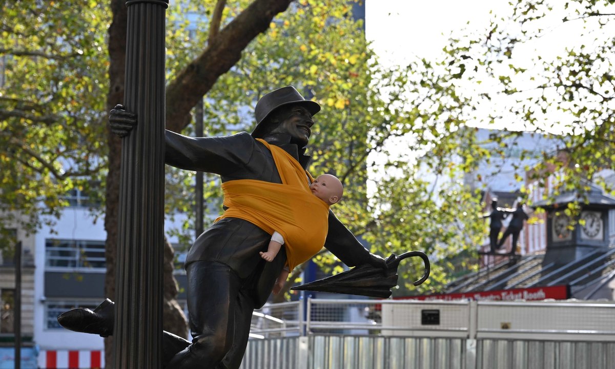 baby slings placed on London statues in push for improved paternity leave baby slings placed on London statues in push for improved paternity leave